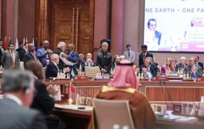 Who’s Sitting Behind Modi?